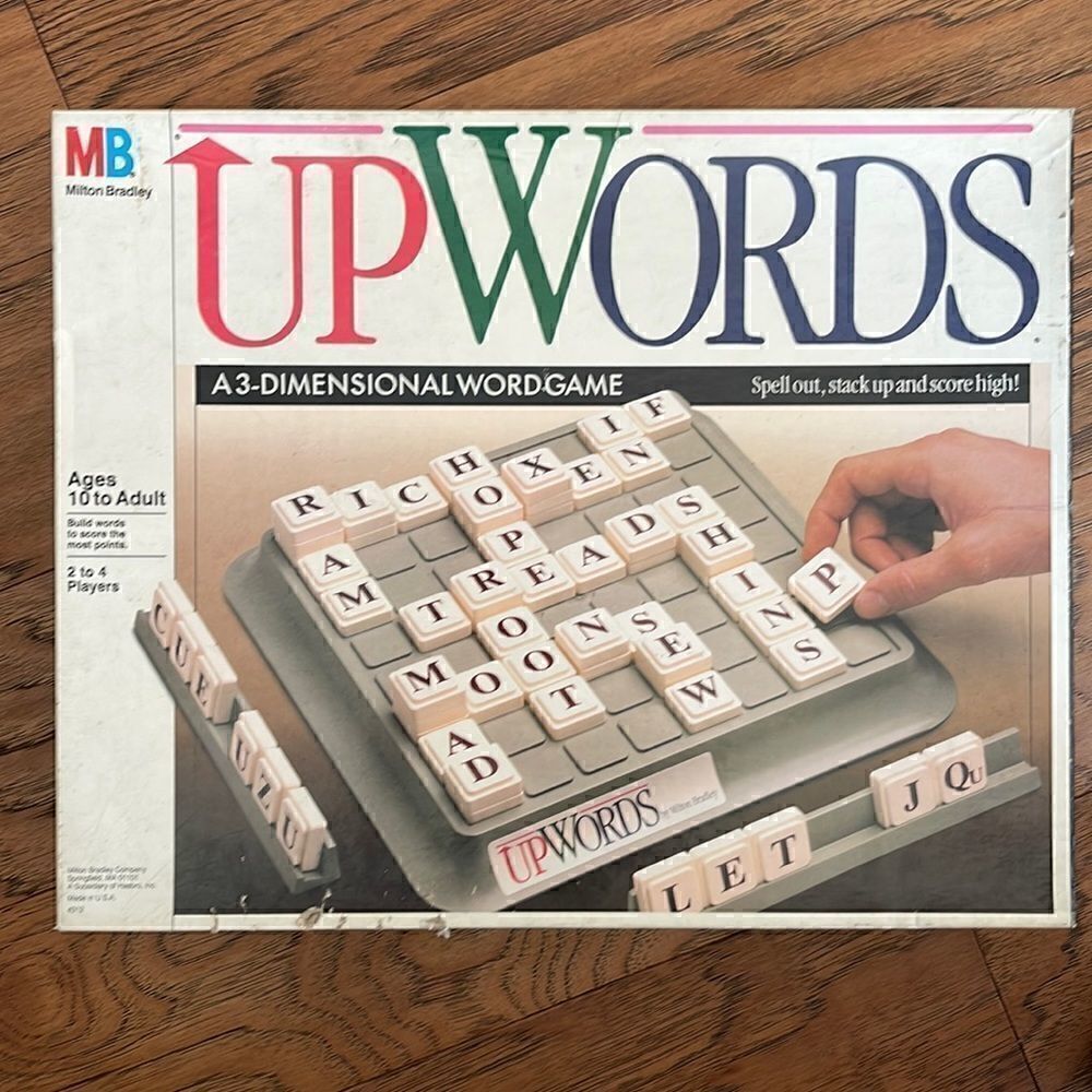 Upwards.  A 3-D word game.  64 letter tiles, 4 plastic racks, game board unit.